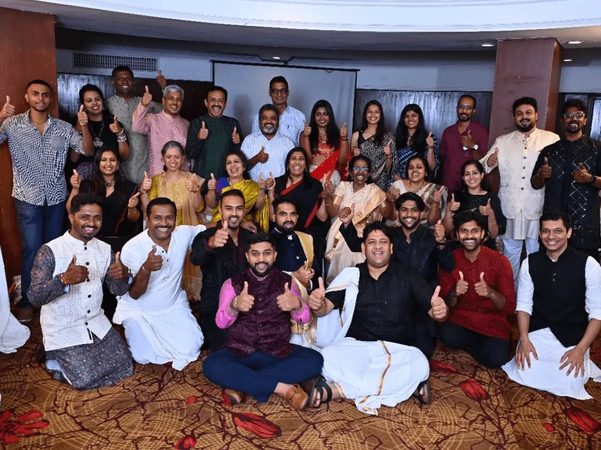 Toastmasters club members posing for a festive group photo in Bangalore